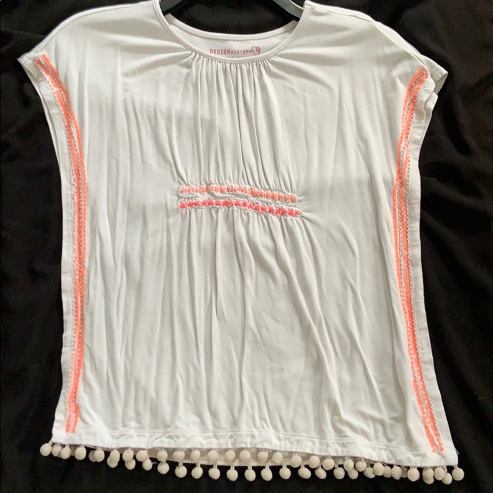 A white blouse with tassel cover-up shirt